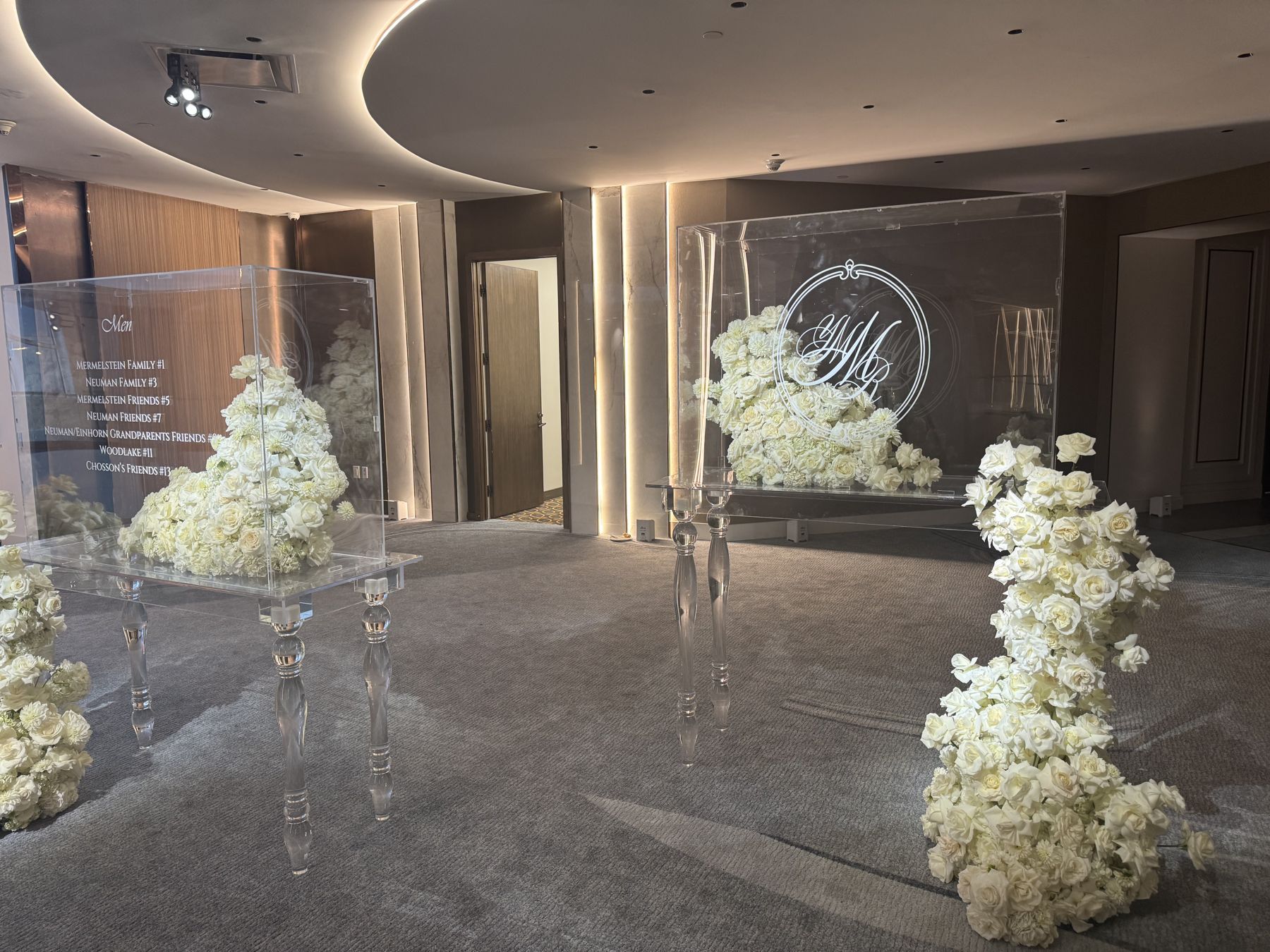 A floral entrance with a monogram in the ballroom foyer