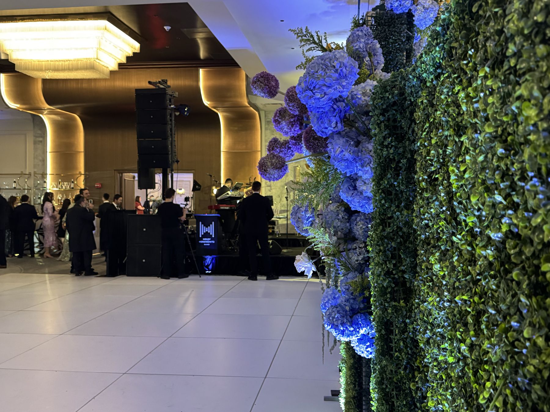 The dance floor beside a wall of hydrangea