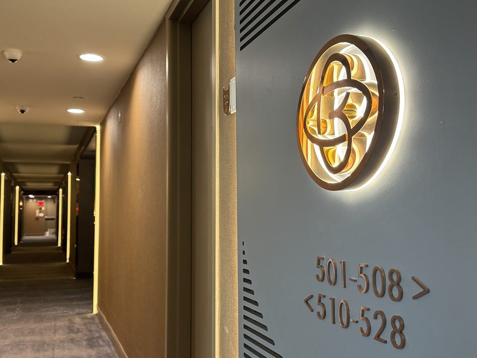 The lit World of Blue mark on a guest floor