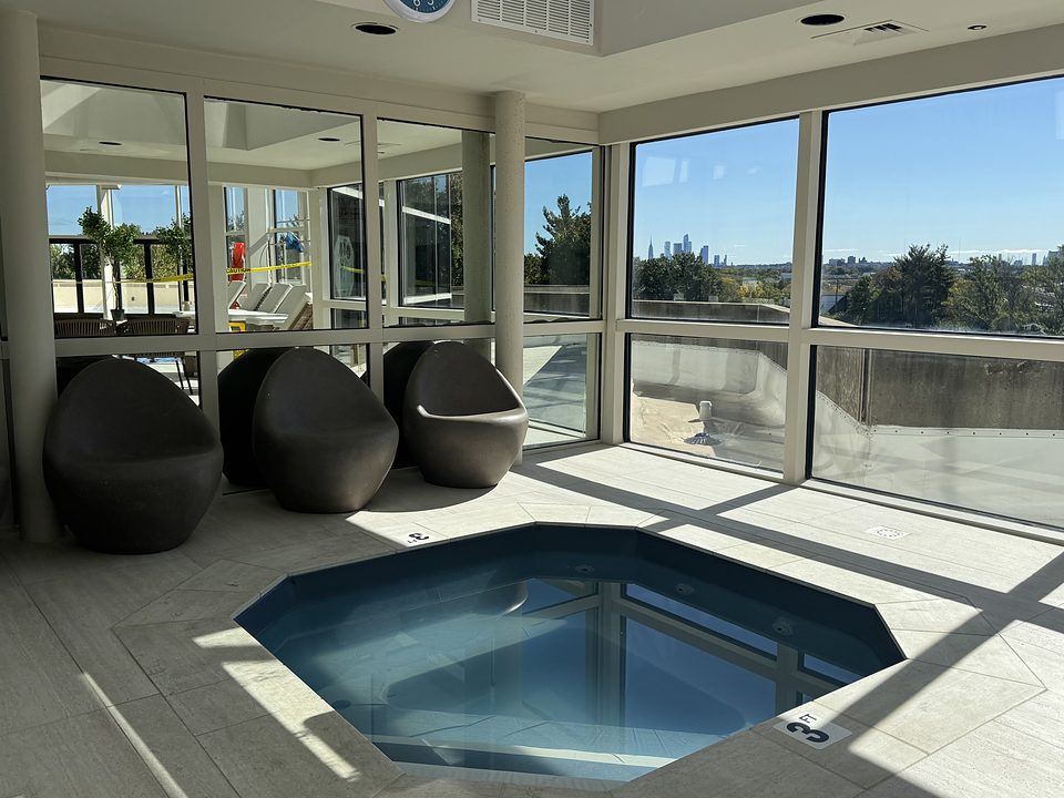 The hot tub beside the pool