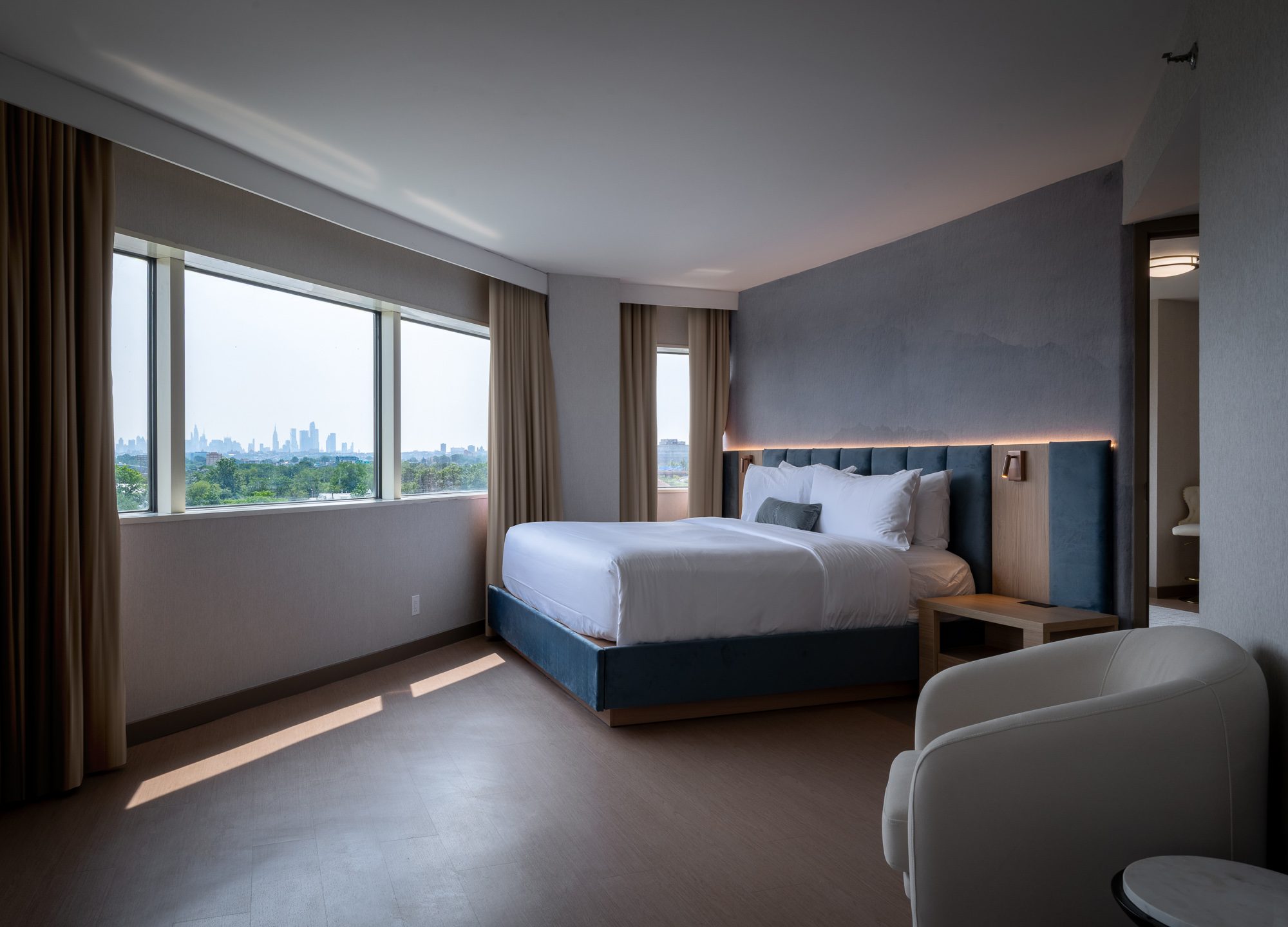 The king suite bedroom with large windows